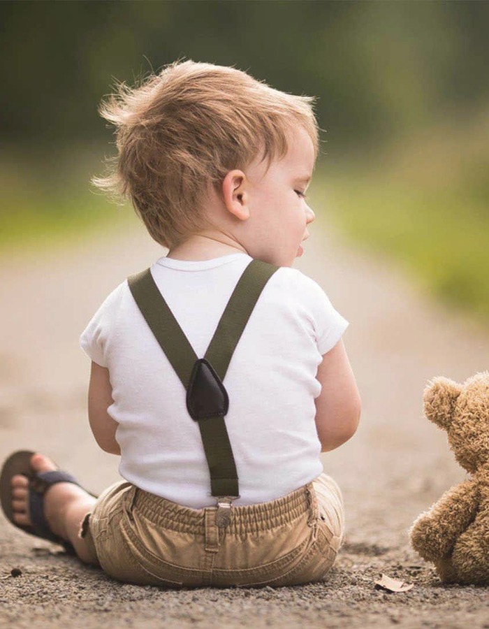 Child sitting with teddy bear, representing All About Speech Therapy services for children and K-12 students